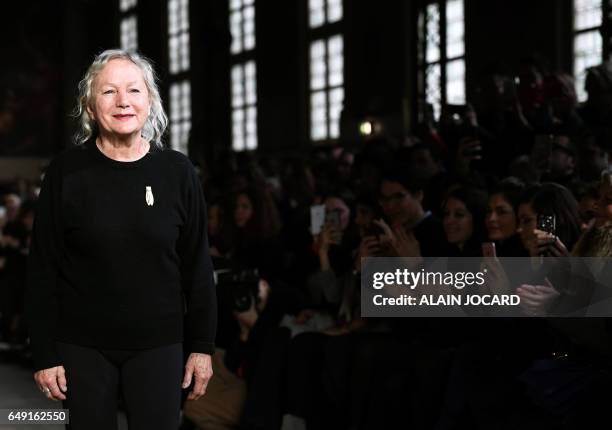 French fashion designer Agnes B. Acknowledges the audience following the presention of creations by Agnes B. During the women's Fall-Winter 2017-2018...