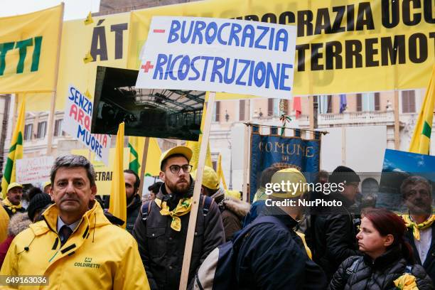 Italian farmers gather in front of the Chamber of Deputees in Rome to protest against the delays in the promised state aid for reconstruction after...