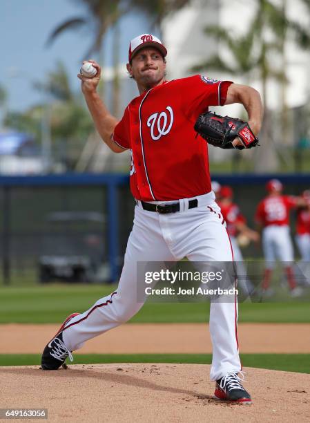 Max Scherzer of the Washington Nationals throws the ball during a morning workout prior to the spring training game against the Boston Red Sox at The...
