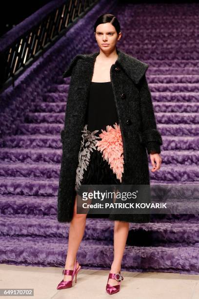 Model Kendall Jenner presents a creation by Miu Miu during the women's Fall-Winter 2017-2018 ready-to-wear collection fashion show, on March 7, 2017...