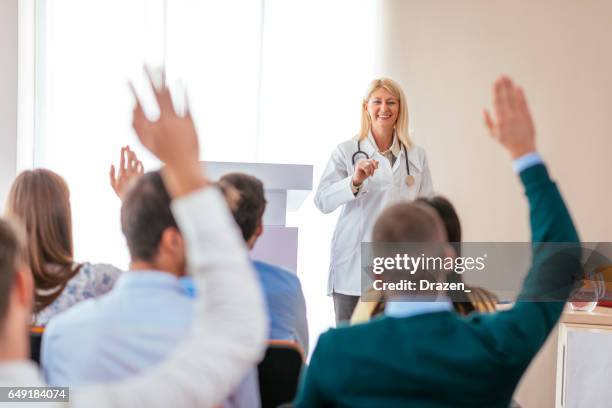 science and research programme on medical class with senior female professor - medical demonstration stock pictures, royalty-free photos & images