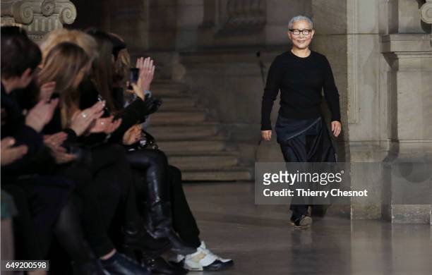 Designer Moon Young Hee acknowledges the audience after presenting his Fall/Winter 2017/18 Ready to Wear collection during the Paris Fashion Week on...