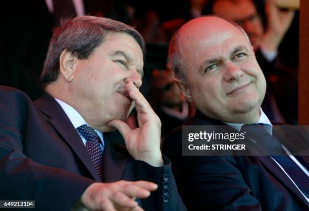 Algerian National Security's General Major Abdelghani Hamel chats with French Interior Minister Bruno Le Roux during a ceremony marking the launch of...