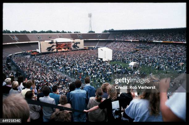 General view of the stage and the audience in the stadiume watching U2 perform during The Joshua Tree Tour, Feyenoord Stadion, De Kuip, Rotterdam,...