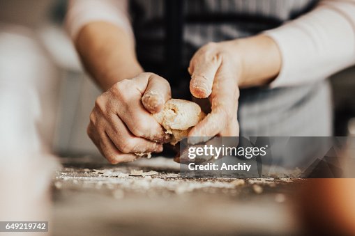 Close-up of woman's hands kneading dough Close-up of woman's hands kneading dough