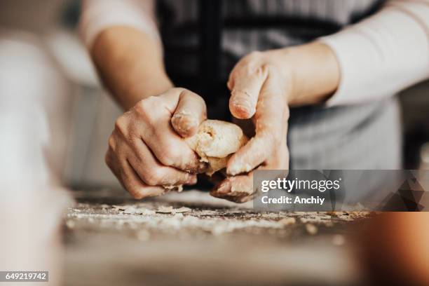 close-up of woman's hands kneading dough - baked stock pictures, royalty-free photos & images