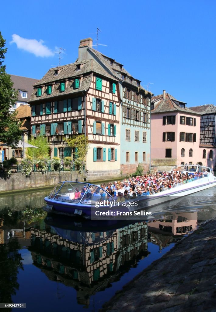 Tourists in a boat tour enjoying Strasbourg, France