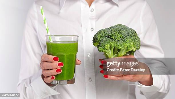 clean eating and drinking - drinking juice from a straw stock pictures, royalty-free photos & images