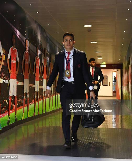 Arsenal's Alexis Sanchez arrives at the home changing room before the UEFA Champions League Round of 16 second leg match between Arsenal FC and FC...