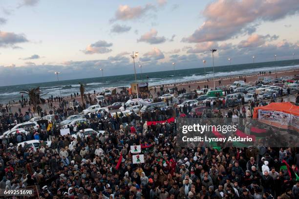 Libyans celebrate outside the courthouse in Benghazi, where the opposition is setting up its own government in opposition to Muammar al-Gaddafi,...