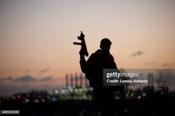 Opposition troops wake up at dawn at the main checkpoint near the oil refinery on the eastern edge of Ras Lanuf, Libya, Monday, March 7, 2011....