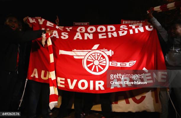 Arsenal fans march in protest outside the stadium prior to the UEFA Champions League Round of 16 second leg match between Arsenal FC and FC Bayern...