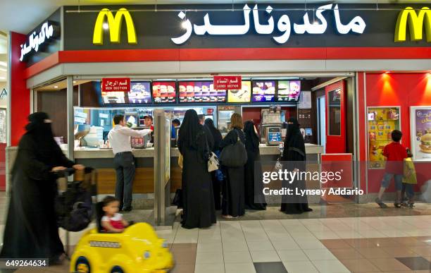 Saudis wait in line at a McDonald's in the Kingdom Center, Riyadh, Saudi Arabia, June 11, 2011.