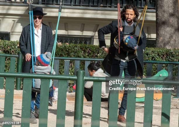 Part of this image has been pixellated to obscure the identity of the child). Raquel Sanchez Silva, Matias Dumont and their twin sons Bruno Dumont...