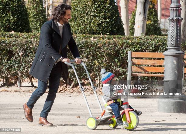 Part of this image has been pixellated to obscure the identity of the child). Matias Dumont and their twin son are seen on January 13, 2017 in...