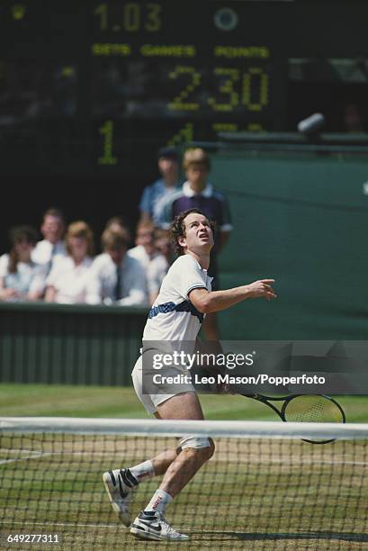 American tennis player John McEnroe pictured in action competing to reach the quarterfinals of the Men's Singles tournament at the Wimbledon Lawn...