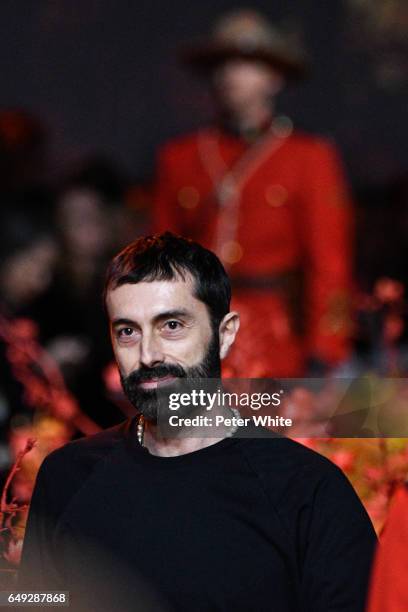 Designer Giambattista Valli walks the runway after the Moncler Gamme Rouge show as part of the Paris Fashion Week Womenswear Fall/Winter 2017/2018 >>...