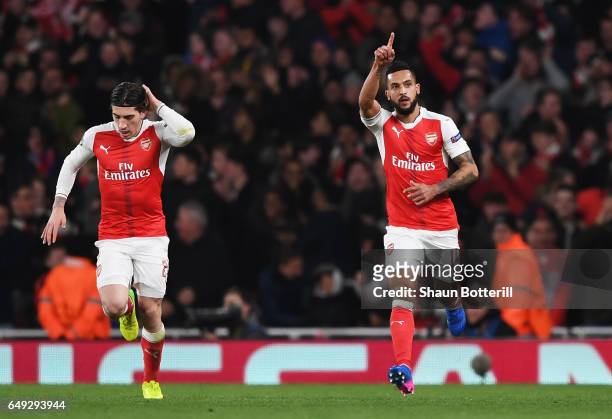 Theo Walcott of Arsenal celebrates as he scores their first goal with Hector Bellerin during the UEFA Champions League Round of 16 second leg match...