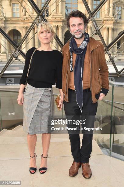 Marina Fois and Eric Lartigau attend the Louis Vuitton show as part of the Paris Fashion Week Womenswear Fall/Winter 2017/2018 on March 7, 2017 in...