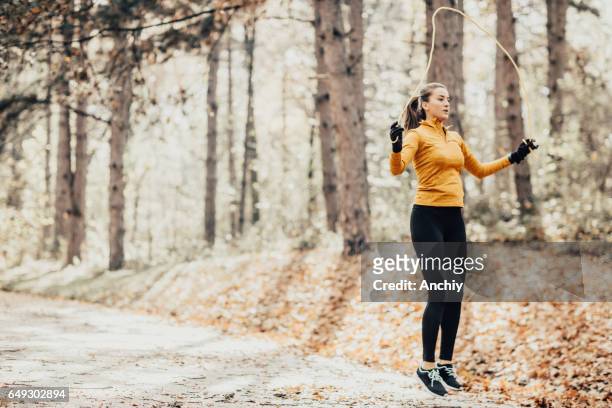 teenager exercising outdoors early in the morning - woman skipping stock pictures, royalty-free photos & images