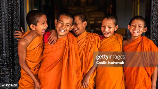 group of happy novice buddhist monks, bhaktapur - stupa stock pictures, royalty-free photos & images