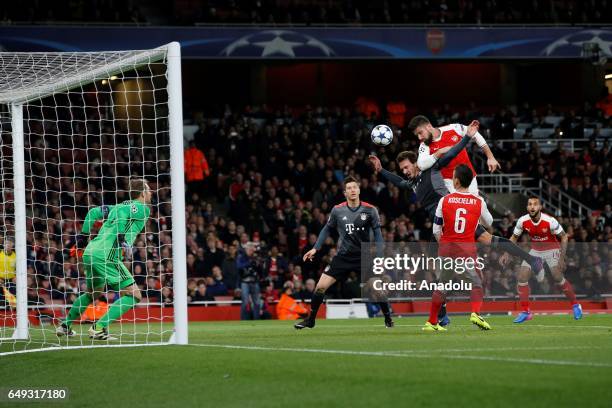 Manuel Neuer of Bayern Munich in action against Olivier Giroud of Arsenal during the UEFA Champions League Round of 16 second leg match between...