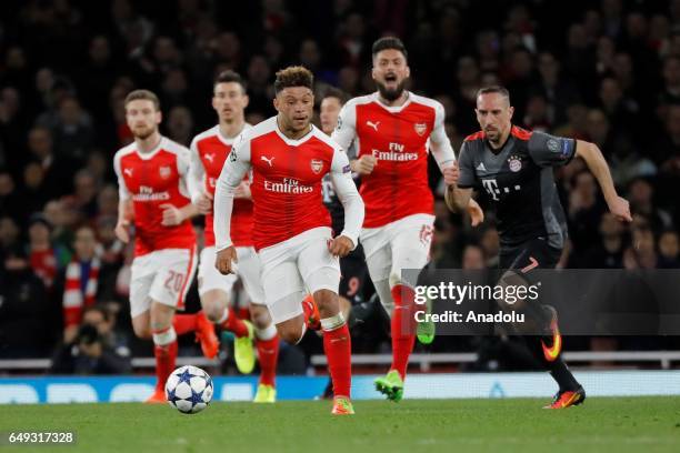 Franck Ribery of Bayern Munich in action against Alex Oxlade-Chamberlain of Arsenal during the UEFA Champions League Round of 16 second leg match...