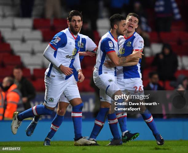 Blackburn Rovers' Derrick Williams is congratulated on scoring his team's equalising goal during the Sky Bet Championship match between Blackburn...