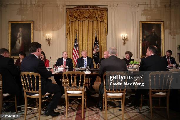 President Donald Trump speaks as House Majority Whip Rep. Steve Scalise , Rep. Kevin Brady and other House members listen during a meeting with the...