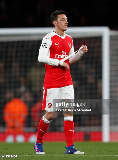 Mesut Oezil of Arsenal looks dejected after losing the UEFA Champions League Round of 16 second leg match between Arsenal FC and FC Bayern Muenchen...