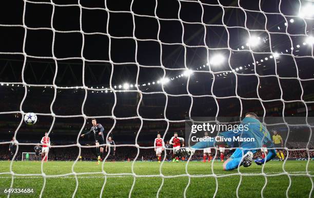 Robert Lewandowski of Bayern Muenchen scores their first goal past goalkeeper David Ospina of Arsenal from a penalty during the UEFA Champions League...