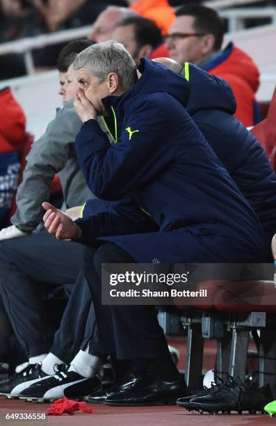 Arsene Wenger, Manager of Arsenal looks dejected on the bench during the UEFA Champions League Round of 16 second leg match between Arsenal FC and FC...