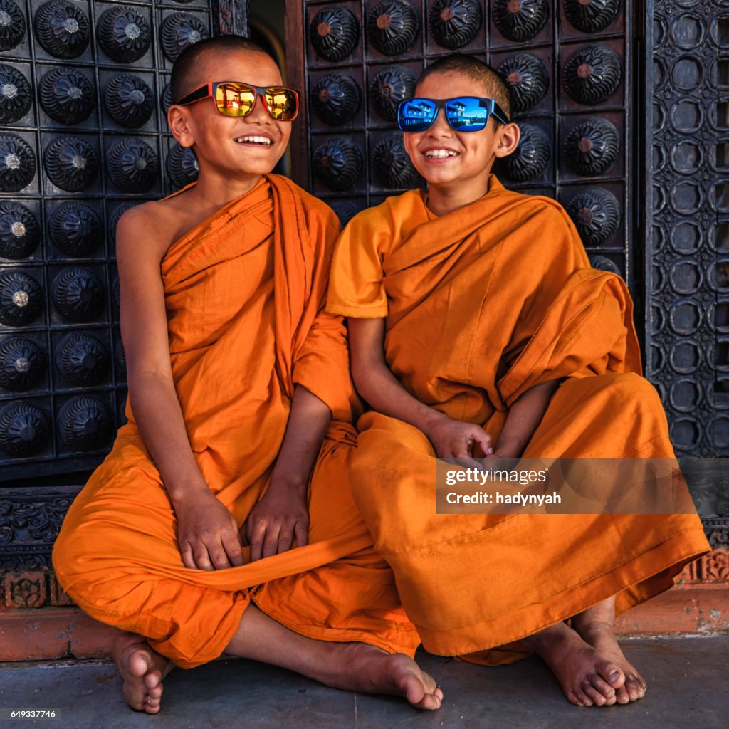 Happy Novice Buddhist monks wearing sunglasses, Bhaktapur