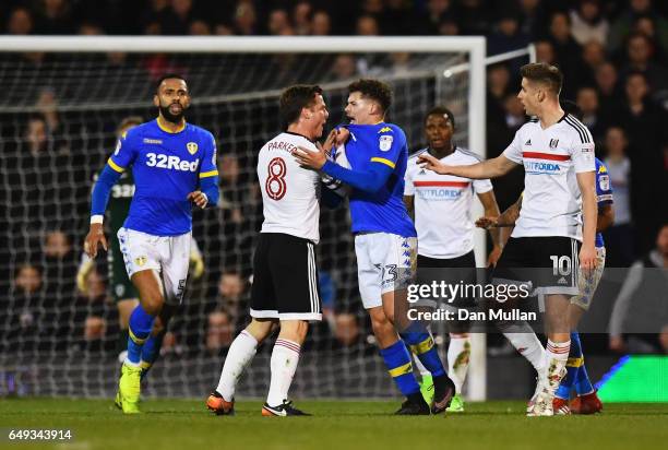 Scott Parker of Fulham clashes with Kalvin Phillips of Leeds United and is sent off during the Sky Bet Championship match between Fulham and Leeds...