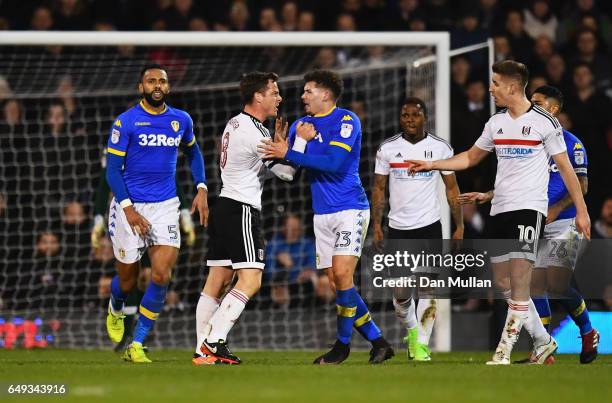 Scott Parker of Fulham clashes with Kalvin Phillips of Leeds United and is sent off during the Sky Bet Championship match between Fulham and Leeds...