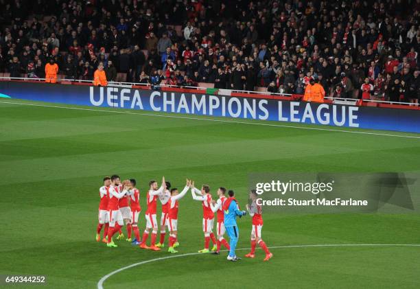 The Arsenal team line up before the UEFA Champions League Round of 16 second leg match between Arsenal FC and FC Bayern Muenchen at Emirates Stadium...