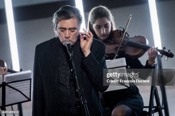 Musicien Blixa Bargeld performs during a Yang LI event At Palais de Tokyo as part of the Paris Fashion Week Womenswear Fall/Winter 2017/2018 on March...