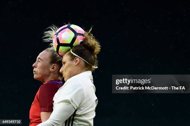 Toni Duggan of England and Babett Peter of Germany go after the ball in the second half during the 2017 SheBelieves Cup at RFK Stadium on March 7,...