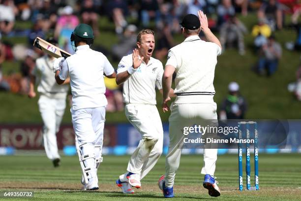 Neil Wagner of New Zealand celebrates the dismissal of JP Duminy of South Africa during day one of the First Test match between New Zealand and South...