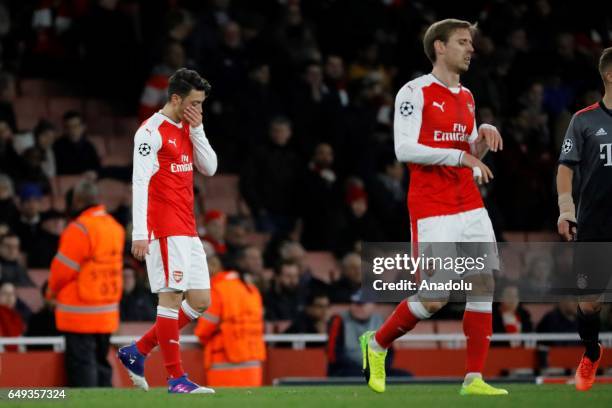 Arsenals Mesut Özil and Arsenals Nacho Monreal react during the UEFA Champions League match between Arsenal FC and Bayern Munich at Emirates Stadium...