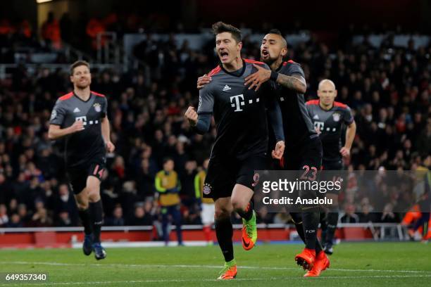 Bayern Munich players celebrate after a goal during the UEFA Champions League match between Arsenal FC and Bayern Munich at Emirates Stadium on March...