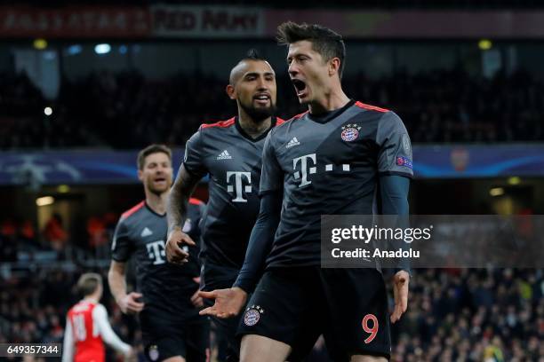 Bayern Munich's Arturo Vidal and Bayern Munich's Robert Lewandowski celebrate after a goal during the UEFA Champions League match between Arsenal FC...