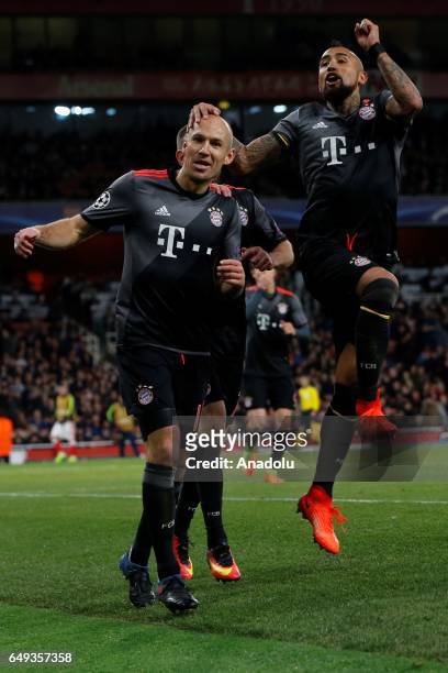 Bayern Munich's Arjen Robben celebrates with Bayern Munich's Arturo Vidal during the UEFA Champions League match between Arsenal FC and Bayern Munich...