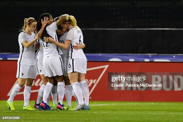 Camille Abily of France celebrates with her teammates after scoring a goal against the United States of America in the first half during the 2017...