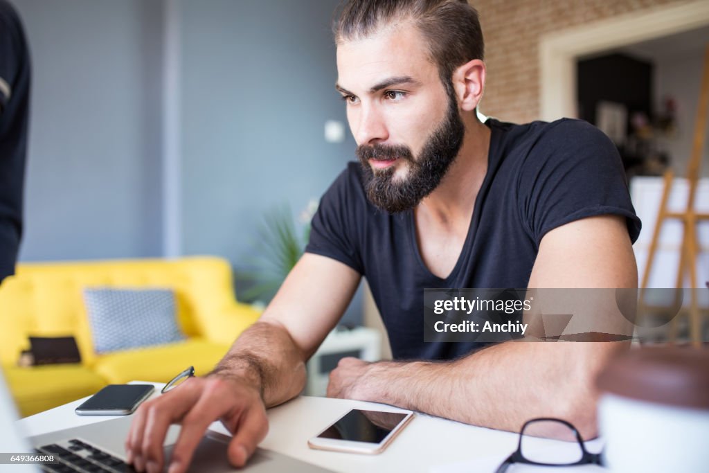 Architect working at his laptop in the office