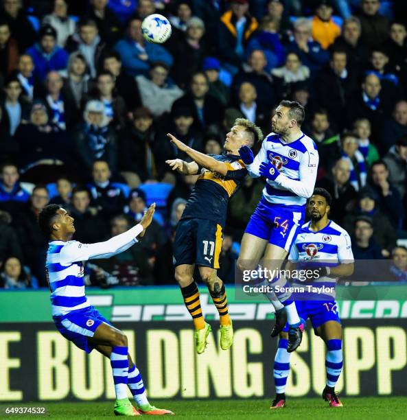 Matt Ritchie of Newcastle United and Jordon Mutch of Reading contest the ball during the Sky Bet Championship Match between Reading and Newcastle...