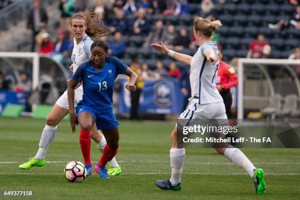 Kadidiatou Diani of France controls the ball against Jill Scott and Ellen White of England during the SheBelieves Cup at Talen Energy Stadium on...