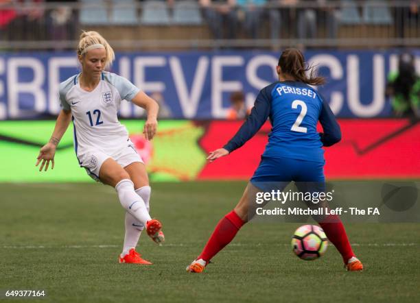 Rachel Day of England passes the ball against Eve Perisset of France during the SheBelieves Cup at Talen Energy Stadium on March 1, 2017 in Chester,...
