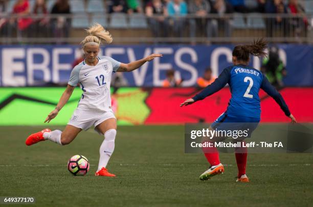 Rachel Day of England passes the ball against Eve Perisset of France during the SheBelieves Cup at Talen Energy Stadium on March 1, 2017 in Chester,...