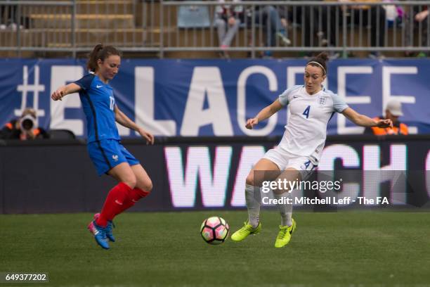 Gaëtane Thiney of France and Lucy Bronze of England fight for the ball during the SheBelieves Cup at Talen Energy Stadium on March 1, 2017 in...